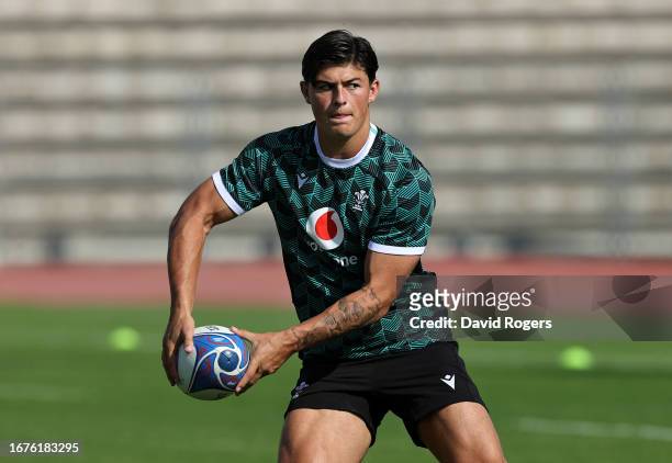 Louis Rees-Zammit passes the ball during the Wales training session at the Rugby World Cup France 2023 held at the Stade Charles Ehrmann on September...