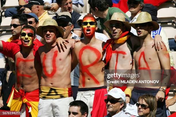 Spanish supporters cheer their team, 16 June 2004 at Bessa stadium in Porto, before the Euro 2004 Group A football match between Greece and Spain at...