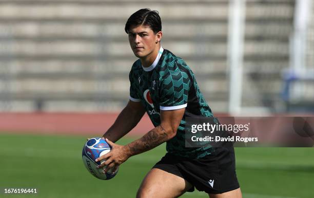 Louis Rees-Zammit runs with the ball during the Wales training session at the Rugby World Cup France 2023 held at the Stade Charles Ehrmann on...