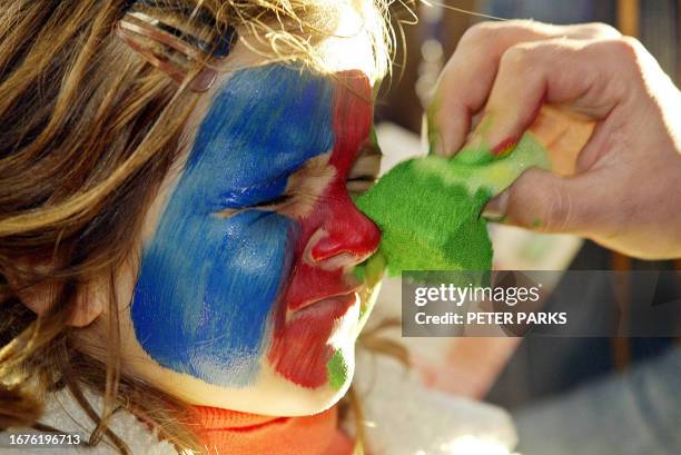 Little girl has Namibian colours painted on her face at York Stadium in Launceston before the game between Romania and Namibia in their last Pool A...