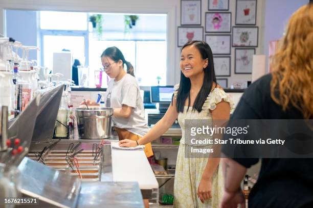 Chau Truong, founder of Tin Tea, speaks with customers while they wait for their orders Wednesday, August 2 at Tin Tea in Northfield, Minn. Chau...