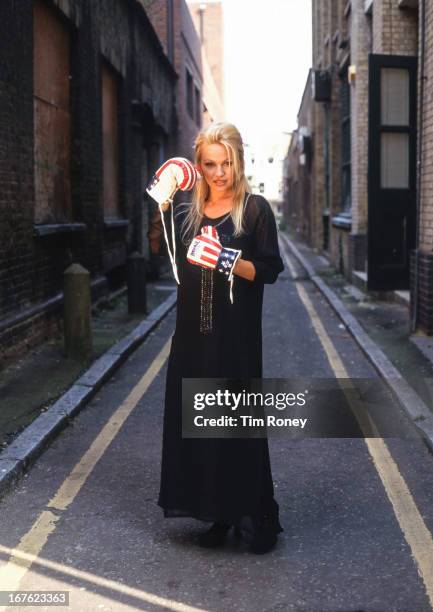 Pamela Anderson wearing boxing gloves, circa 1995.