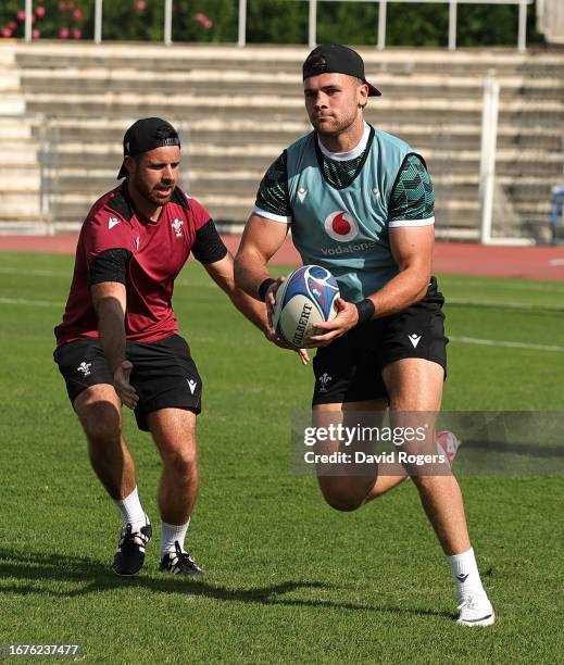 Mason Grady breaks with the ball during the Wales training session at the Rugby World Cup France 2023 held at the Stade Charles Ehrmann on September...