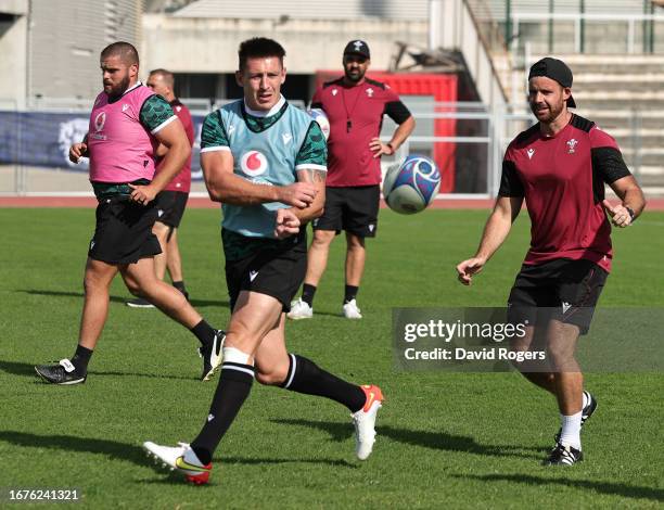 Josh Adams passes the ball during the Wales training session at the Rugby World Cup France 2023 held at the Stade Charles Ehrmann on September 12,...