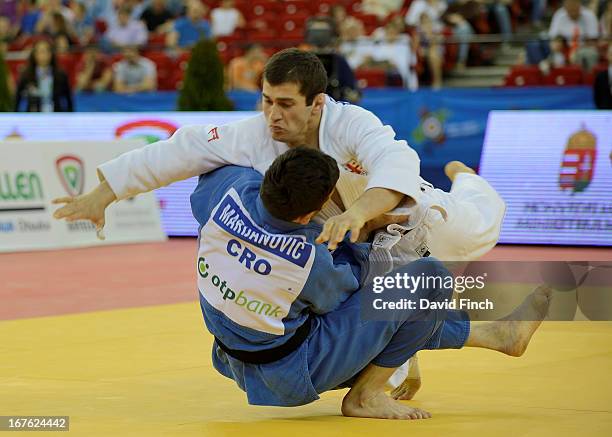 Avtandil Tchrikishvili of Georgia narrowly defeats Tomislav Marijanovic of Croatia to win the u81kgs final at the Budapest European Championships...