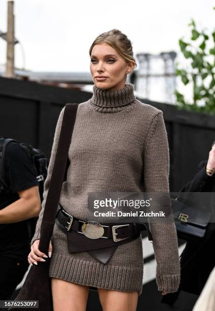 Elsa Hosk is seen wearing a brown knit sweater dress and black and silver belt outside the Michael Kors show during NYFW S/S 2024 on September 11,...