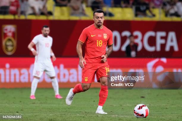 Li Ke of China drives the ball during an international friendly match between China and Syria at Fenghuangshan Sports Park Professional Football...