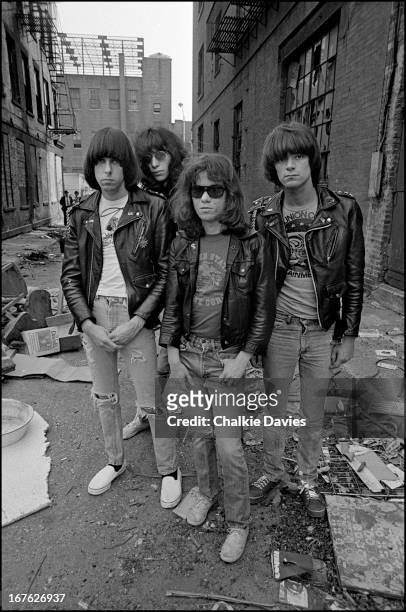 American punk rock group The Ramones in an alleyway off the Bowery, New York, 1977. Left to right: guitarist Johnny Ramone , singer Joey Ramone ,...