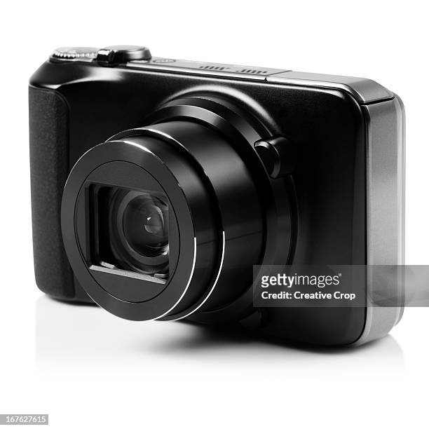 front view of black digital camera - macchina fotografica digitale foto e immagini stock