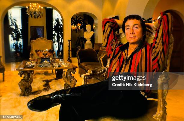 Portrait of Penthouse Magazine founder and publisher Bob Guccione , hands behind his head, as he sits in the living room of his Upper East Side...