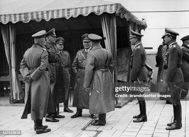 War minister Werner von Blomberg , state secretary Erhard Milch and minister president Hermann Göring on the roof of the Ministry of Aviation....