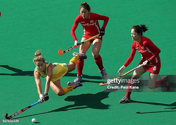 Ashleigh Nelson of Australia dives for the ball against An Hyo Ju and Kim Jong Hee of Korea during the International Test match between the...