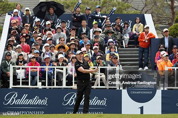 Stephen Gallacher of Scotland hits his tee-shot on the first hole during the third round of the Ballantine's Championship at Blackstone Golf Club on...
