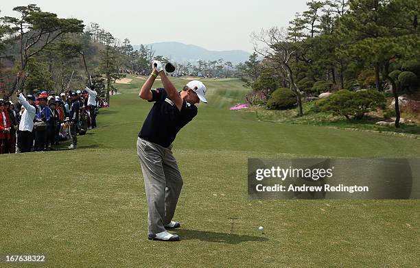 Paul Lawrie of Scotland hits his tee-shot on the tenth hole during the third round of the Ballantine's Championship at Blackstone Golf Club on April...