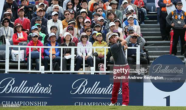 Romain Wattel of France hits his tee-shot on the first hole during the third round of the Ballantine's Championship at Blackstone Golf Club on April...