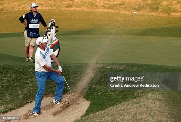 Marcus Fraser of Australia hits his fourth shot on the 18th hole during the third round of the Ballantine's Championship at Blackstone Golf Club on...