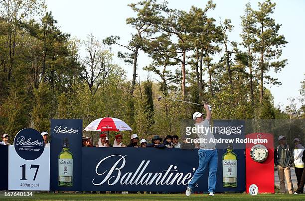 Marcus Fraser of Australia hits his tee-shot on the 17th hole during the third round of the Ballantine's Championship at Blackstone Golf Club on...