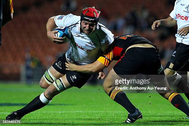 Sharks' Franco van der Merwe charges into Chiefs' Rhys Marshall during the round 11 Super Rugby match between the Chiefs and the Sharks at Waikato...
