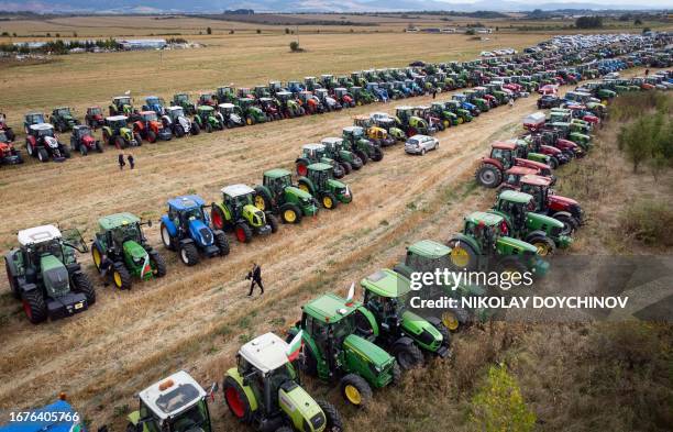 This aerial picture shows tractors parked in a field during a protest against the lifting of ban on imports of grain coming from Ukraine, in Dolni...