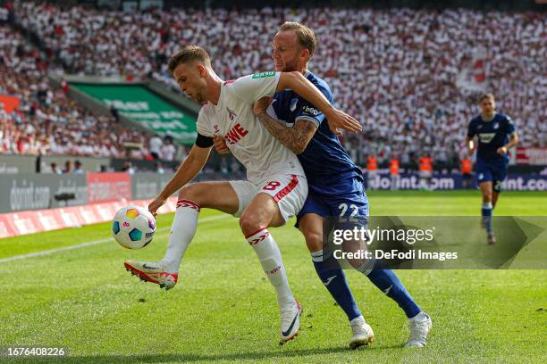 Denis Huseinbasic of 1. FC Koeln and Kevin Vogt of TSG 1899 Hoffenheim battle for the ball during the Bundesliga match between 1. FC Köln and TSG...