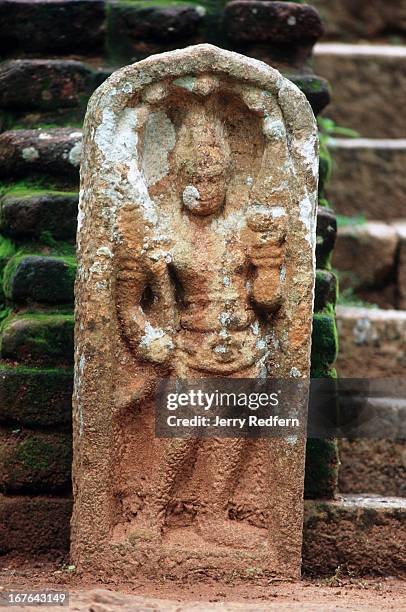 View of an ancient statue on the dais surrounding the Ambasthale Dagoba at Mihintale. Buddhism originated in Sri Lanka in this spot in 247 BC, when...