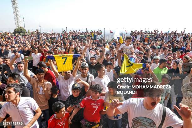 Fans of Saudi football club al-Nassr's Portuguese forward Cristiano Ronaldo gather outside the team's hotel in Tehran on September 18, 2023 a day...