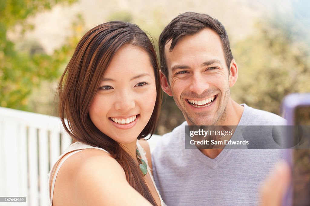 Couple taking picture of themselves