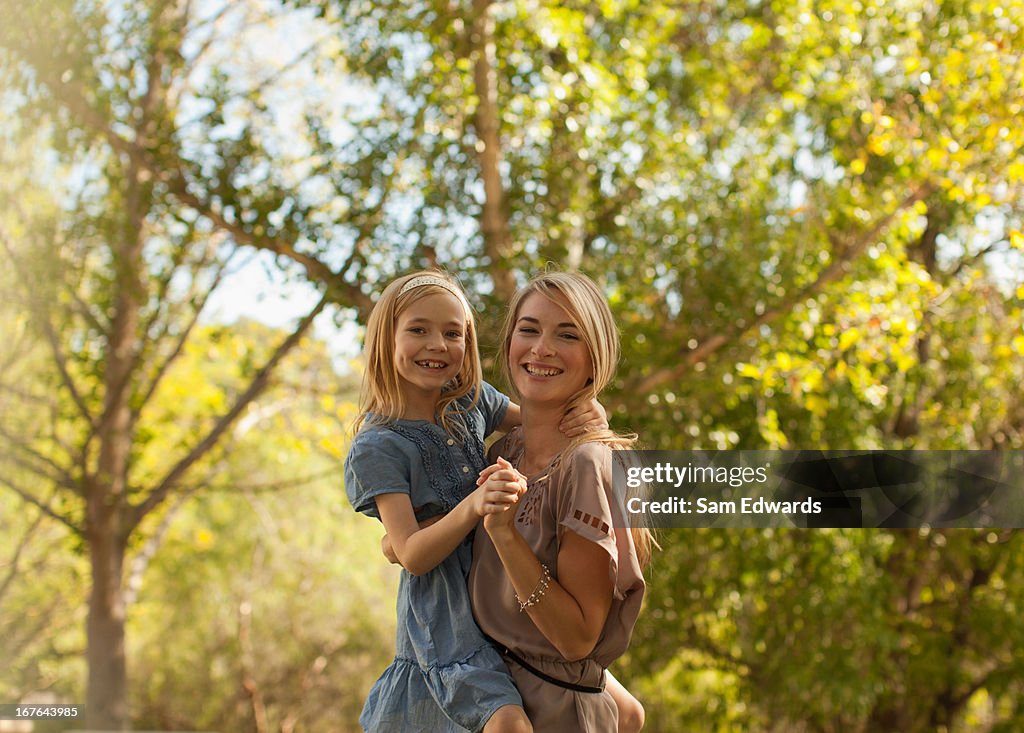 Mother and daughter playing outdoors