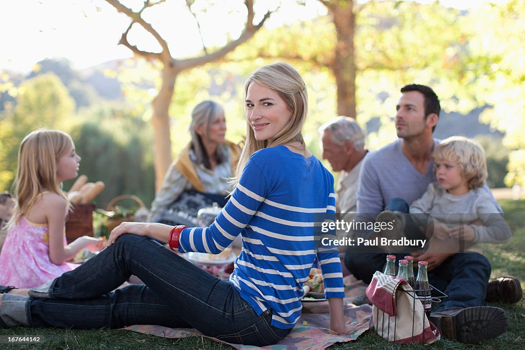 Family picnicking together on grass