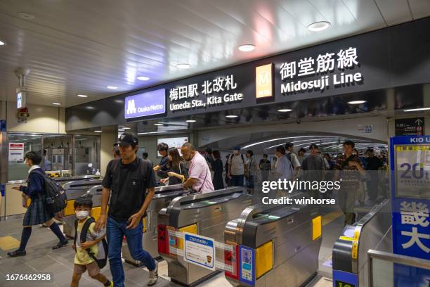 osaka metro midosuji line umeda station in osaka, japan - osaka prefecture stock pictures, royalty-free photos & images