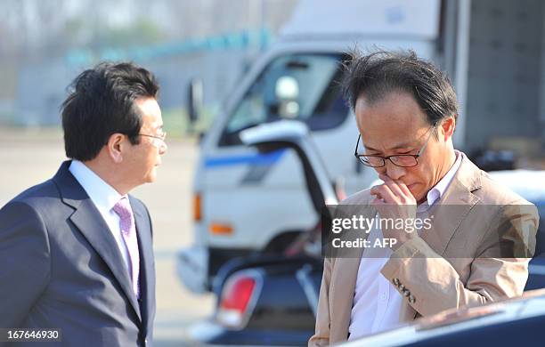 Choi Yoon-Sik a businessman of a clothing company which has a factory at the inter-Korean Kaesong Industrial Complex in North Korea, weeps after...