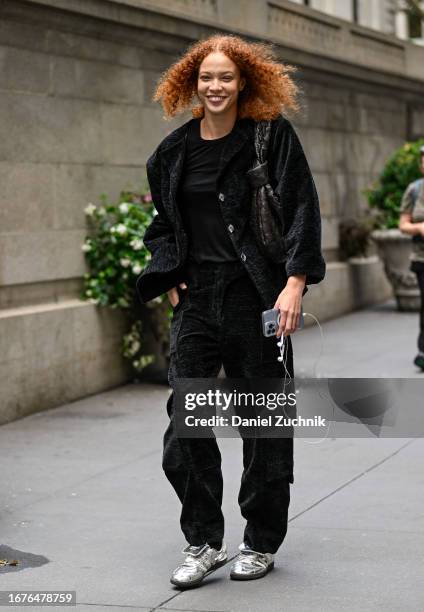 Model Tianna St. Louis is seen wearing a black jacket, black t-shirt, black pants and white sneakers outside the Altuzarra show during NYFW S/S 2024...