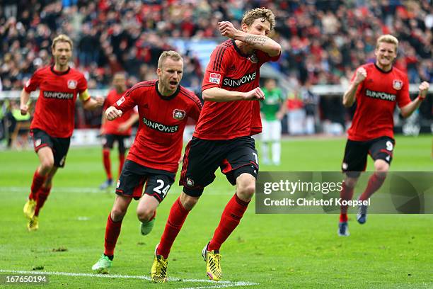 Stefan Kiessling of Leverkusen celebrates the first goal with Simon Rolfes , Michal Kadlec and Andre Schuerrle during the Bundesliga match between...