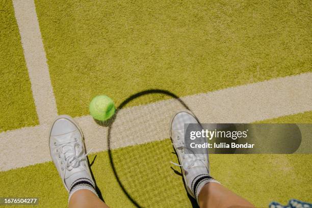 tennis ball and tennis racket shadow on a tennis court floor - tennis ball on court stock pictures, royalty-free photos & images