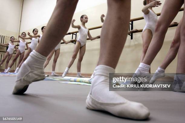 Picture taken on April 8, 2008 shows a ten-year-old Russian would-be ballerina's performing warm up exercises at the Vaganova Ballet Academy in St....