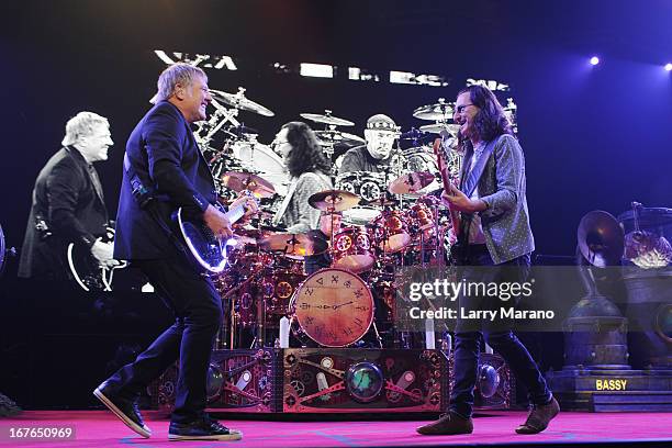 Alex Lifeson, Neil Peart and Geddy Lee of Rush perform at BB&T Center on April 26, 2013 in Sunrise, Florida.
