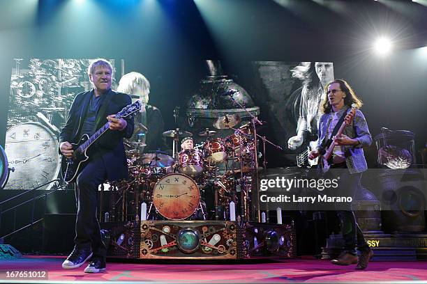 Alex Lifeson, Neil Peart and Geddy Lee of Rush perform at BB&T Center on April 26, 2013 in Sunrise, Florida.