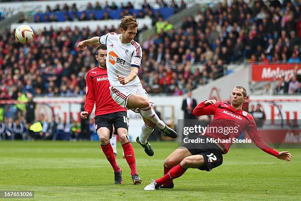 Matthew Connolly of Cardiff City blocks a shot from Craig Dawson of Bolton Wanderers during the npower Championship match between Cardiff City and...