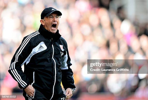 Tony Pulis the Stoke manager shouts instructions to his players during the Barclays Premier League match between Stoke City and Norwich City at the...