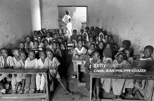 Children attend 22 March 2001 class in a Koranic school in a low-income neighborhood of Abidjan. Muslim children in Abidjan's poor neighborhoods of...