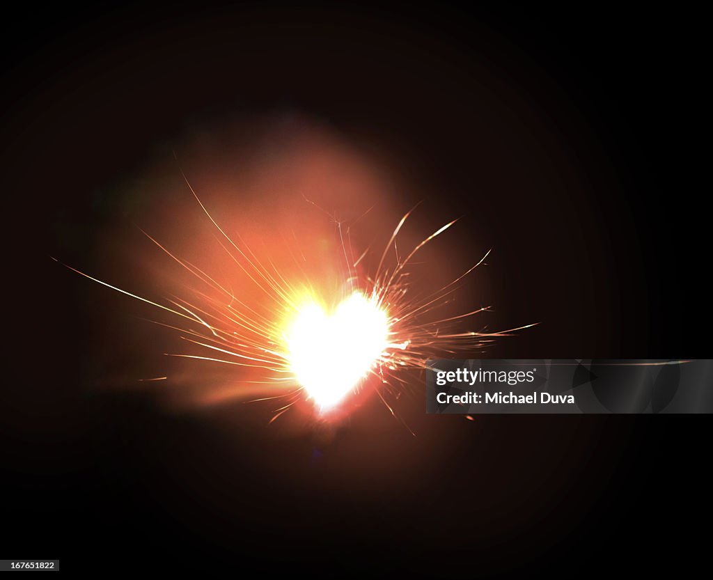 Sparkler exploding heart on fire