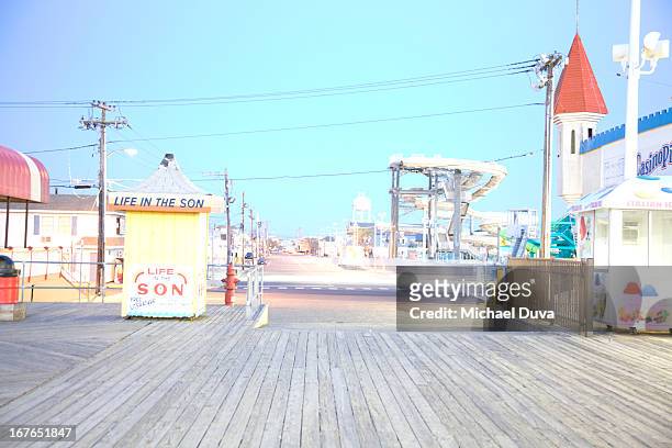 boardwalk and amusement rides in seaside heights - boardwalk ストックフォトと画像