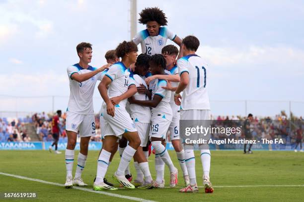 Shea Lacey of England celebrates with team mates after scoring the team's fourth goal during the International Friendly match between England U17 and...