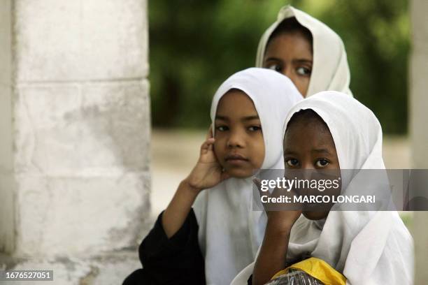 Muslim girls are pictured 08 October 2005 outside a Coranic school in Stone Town, Zanzibar. AFP PHOTO/MARCO LONGARI