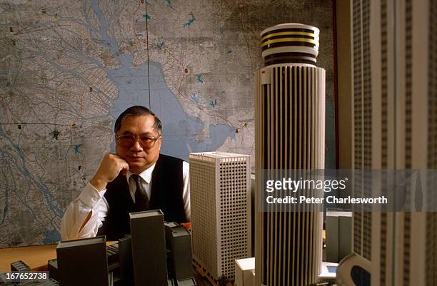 Gordon Wu - head of Hopewell Holdings Ltd. He is sitting behind a model of the Hopewell Center - a large Hong Kong property development..