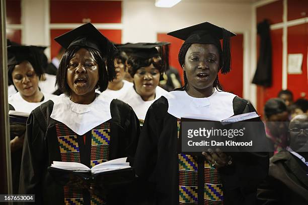 The choir sings during a 'Seventh Day Evangelist' service at Crossway Church in the Heygate Estate on April 27, 2013 in London, England. The Crossway...