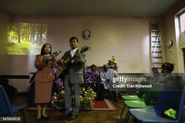 Song is sung ahead of a 'Seventh Day Evangelist' service at Crossway Church in the Heygate Estate on April 27, 2013 in London, England. The Crossway...