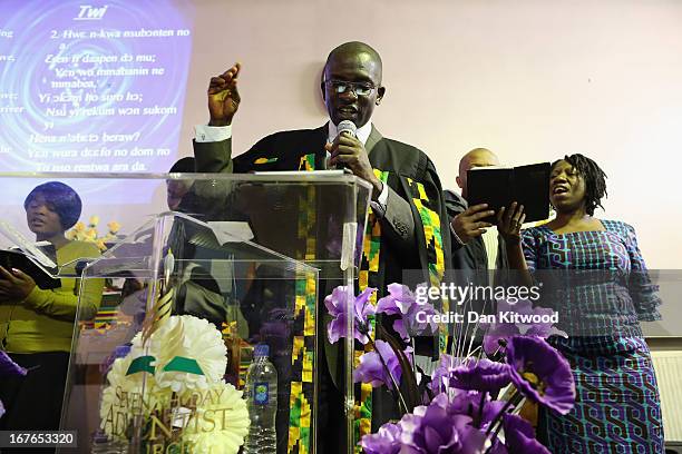 Songs are sung during a 'Seventh Day Evangelist' service at Crossway Church in the Heygate Estate on April 27, 2013 in London, England. The Crossway...