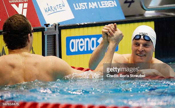 Steffen Deibler of Hamburger SC celebrates with his brother Markus after winning the men's 100m freestyle A final during day two of the German...