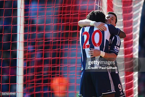 Shane Long of West Bromwich Albion celebrates with Romelu Lukaku after scoring the third goal for West Bromwich Albion during the Barclays Premier...